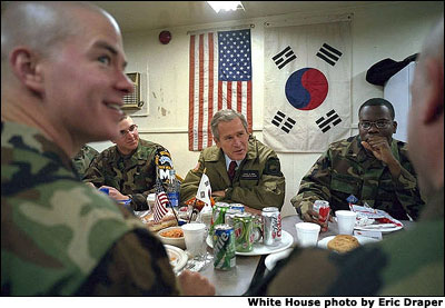 During his tour of Observation Post Oullette, President George W. Bush eats lunch with troops Wednesday, Feb. 20, 2002. White House photo by Eric Draper.