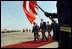 President George W. Bush and Peruvian President Alejandro Toledo participate in the arrival ceremony at the Jarez Chavez International Airport in Cullao, Peru, Saturday, March 23, 2002. The first sitting President to visit Peru, President Bush announced several aggressive programs designed to build a strong relationship between America and Peru. White House photo by Eric Draper