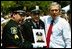 President George W. Bush stands for pictures during the Annual Peace Officers' Memorial Service at the U.S. Capitol in Washington, D.C., Saturday, May 15, 2004. "Our fallen officers died in service to justice, and in defense of the innocent," said President Bush. "They will never be forgotten by their comrades, they will never be forgotten by their country." 