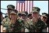 Marines react to remarks by President George W. Bush to military personnel and their families at Marine Air Corps Station Miramar near San Diego, CA on August 14, 2003.