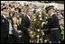 Honoring those who died in service to America, President George W. Bush lays a wreath at the Tomb of the Unknowns in Arlington Cemetery on Veterans Day Nov. 11, 2003. After the wreath was placed, "Taps" was played and a moment of silence was observed.