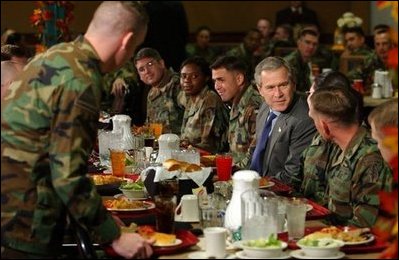 President George W. Bush enjoys lunch with U.S. soldiers at Fort Carson, Colorado Nov. 24, 2003.