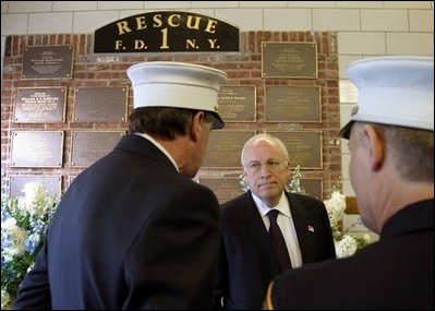 Commemorating the two-year anniversary of the terrorist attacks, Vice President Dick Cheney visits the firehouse of FDNY Rescue Company 1 in New York, N.Y., Sept. 11, 2003. Pictured in the background is a memorial to the station's firefighters who have died in the line of duty, including the company's eleven firefighters who lost their lives Sept. 11, 2001.