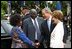 President George W. Bush and Mrs. Laura Bush welcome President Mwai Kibaki and Mrs. Kibaki of the Republic of Kenya to the White House Monday, October 5, 2003. 