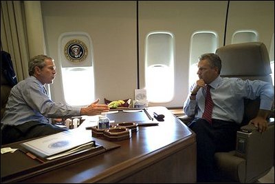 En route to Michigan, President Bush and President Kwasniewski talk on Air Force One. In addition to a private meeting in the President Bush's office, the Polish head of state was treated to a personally-guided tour the famous plane July 18. White House photo by Eric Draper.