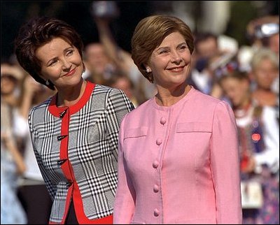 Mrs. Bush and Mrs. Kwasniewska stand together during the South Lawn ceremony at which the national anthems for both countries were performed and their husbands reviewed the troops. White House photo by Susan Sterner.