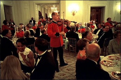 As White House staff and Cabinet members dine with invited guests, members of the Marine Band perform throughout the State Dining Room July 17. White House photo by Eric Draper.