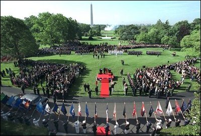 Flags are raised high as President George W. Bush hosts a State Arrival Ceremony for President Gloria Macapagal-Arroyo of the Philippines on the South Lawn Monday, May 19, 2003. "The Philippines was the first democracy in Asia and has a proud tradition of democratic values, love of family and faith in God. President Arroyo, you are carrying this tradition forward, and I'm proud to call you friend," said President Bush in his remarks. "Today the First Lady and I are honored to welcome you and Attorney Arroyo to America and to the White House. Mabuhay!"