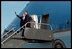 After talking with community leaders and many Toledo-area residents, Presidents Bush and Fox wave goodbye to the crowd at the airport before returning to Washington, D.C. aboard Air Force One.