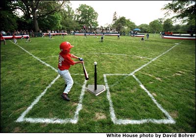 A Rockies player swings during a tee-ball game on the South Lawn. The Rockies are part of Capitol City Little League in Washington, D.C. White House photo by David Bohrer.