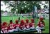 A Devil Dog cheers as a teammate rounds first base during the first game of the 2004 White House Tee Ball season June 13, 2004.