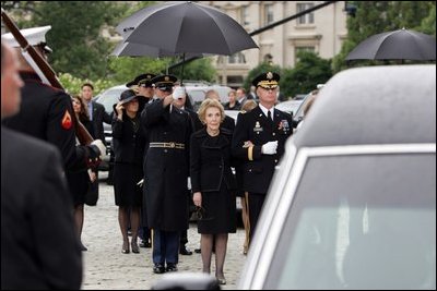 Former First Lady Nancy Reagan watches the casket of former President Ronald Reagan being loaded into a hearse at the funeral service at the National Cathedral in Washington, DC on June 11, 2004. 