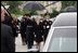 Former First Lady Nancy Reagan watches the casket of former President Ronald Reagan being loaded into a hearse at the funeral service at the National Cathedral in Washington, DC on June 11, 2004. 