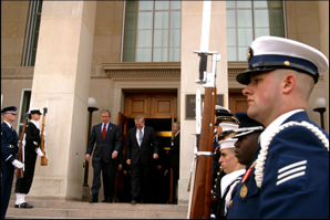 President George W. Bush and Secretary of Defense Donald Rumsfeld walk down the Pentagon stairs to a ceremony where the President signed the National Defense Authorization Act. White House photo by Paul Morse.