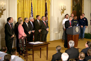 President George W. Bush speaks during the signing of the Terrorism Risk Insurance Act in the East Room, Tuesday, Nov. 26. 'The Terrorism Risk Insurance Act will provide coverage for catastrophic losses from potential terrorist attacks. Should terrorists strike America again, we have a system in place to address financial losses and get our economy back on its feet as quickly as possible,' said the President.