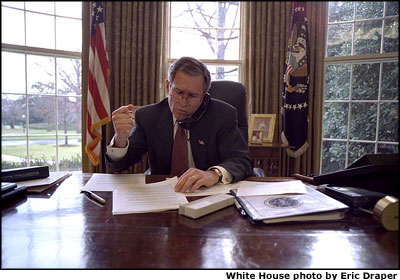  Following the tradition begun by George Washington on Jan. 8, 1790, President George W. Bush prepares for his State of the Union Address at his desk in the Oval Office, Thursday, Jan. 24. White House photo by Eric Draper.