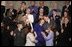 During the State of the Union Address Wednesday, Feb. 2, 2005, Janet and William Norwood, center, comfort each other as President Bush talks about their son, Marine Corps Sergeant Byron Norwood of Pflugerville, Texas, who died during the assault on Fallujah. 