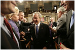 President George W. Bush is congratulated by Tennessee Rep. Harold Ford and Louisiana Sen. Mary Landrieu as he leaves the U.S. House Chamber Tuesday, Jan. 31, 2006, following his State of the Union address.