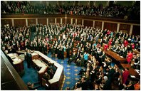 Congress applauds President Bush during his State of the Union Address at the U.S. Capitol Tuesday Jan. 28, 2003. Discussing the spread of the AIDS virus, President Bush asked Congress to commit $15 billion in aid for African nations and the Caribbean tormented by the disease. “The qualities of courage and compassion that we strive for in America also determine our conduct abroad,” said the President. “This conviction leads us into the world to help the afflicted, and defend the peace, and confound the designs of evil men.” 