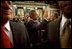 After delivering his State of the Union speech, President Bush waves to his wife, Laura Bush, as he leaves the House Chamber at the U.S. Capitol Tuesday, Jan. 28, 2003. 