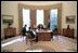 President George W. Bush prepares his State of the Union Address with White House speechwriters Matthew Scully, left, Mike Gerson, center, and John McConnell in the Oval Office Jan. 23, 2003.