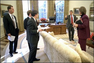 President Bush gives his speechwriting team a few points after revising the State of the Union Address in the Oval Office Jan. 23, 2003. Meeting with the President are, from left, Matthew Scully, John McConnell, Mike Gerson and Advisor Karen Hughes.