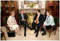 President George W. Bush and President Elias Antonio Saca Gonzalez of El Salvador meet while attending the Summit of the Americas in Mar del Plata, Argentina, Saturday, Nov. 5, 2005.