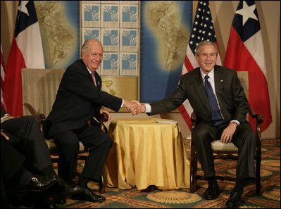 President George W. Bush and Chilean President Ricardo Lago Escobar exchange handshakes Friday, Nov. 4, 2005, during their bilateral meeting at the Sheraton Mar del Plata Hotel in Mar del Plata, Argentina.