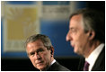 President George W. Bush listens to Argentina's President Nestor Carlos Kirchner as the two hold a joint press availability Friday, Nov. 4, 2005, at the Hermitage Hotel in Mar del Plata, Argentina.