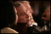 President George W. Bush listens to Secretary of State Condoleezza Rice during the opening session Friday, Nov. 4, 2005, of the 2005 Summit of the Americas in Mar del Plata, Argentina.