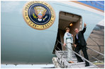 President George W. Bush gives the thumbs-up Saturday, November 5, 2005, as he and Mrs. Laura Bush board Air Force One in Mar del Plata after attending the 2005 Summit of the Americas. The President and First Lady traveled to Brasilia where they will spend Sunday visiting with President Luis Inacio Lula Da Silva. 