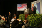 The media swarms President George W. Bush Saturday, Nov. 6, 2005, as he speaks at Blue Tree Stars Hall in Brasilia, Brazil, prior to his departure for Panama. 