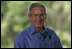 President George W. Bush smiles as he listens through an earpiece to a translation of the remarks by Brazil President Luiz Inacio Lula da Silva Saturday, Nov. 6, 2005, in Brasilia, Brazil. 