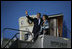 President George W. Bush and Laura Bush wave from Air Force One after landing Thursday, Nov. 3, 2005, in Mar del Plata, Argentina, where the President will participate in the Summit of the Americas. 