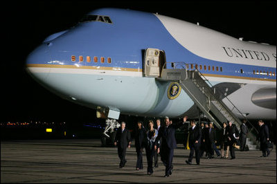 President George W. Bush and Mrs. Laura Bush walk across the tarmac Thursday, Nov. 3, 2005, after arriving at Brigadier General Bartolome de la Colina International Airport in Mar del Plata, Argentina, where the President will participate in the Summit of the Americas. 