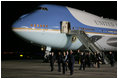 President George W. Bush and Mrs. Laura Bush walk across the tarmac Thursday, Nov. 3, 2005, after arriving at Brigadier General Bartolome de la Colina International Airport in Mar del Plata, Argentina, where the President will participate in the Summit of the Americas. 