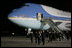 President George W. Bush and Mrs. Laura Bush walk across the tarmac Thursday, Nov. 3, 2005, after arriving at Brigadier General Bartolome de la Colina International Airport in Mar del Plata, Argentina, where the President will participate in the Summit of the Americas. 