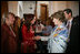 Mrs. Cristina Fernandez de Kirchner welcomes Mrs. Laura Bush to a luncheon Saturday, Nov. 5, 2005, in Mar del Plata, Argentina. The event, hosted by the Argentine First Lady, included a display on Eva Peron and a photo exhibit of important Argentine women depicting their culture.