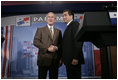 President George W. Bush greets President Martin Torrijos of Panama at the end of a joint press availability with the at Casa Amarilla in Panama City, Panama, Monday, Nov. 7, 2005. 