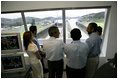 President George W. Bush tours the command center of the Panama Canal's Miraflores Locks with President Martin Torrijos of Panama in Panama City, Panama, Monday, Nov. 7, 2005. 