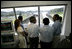 President George W. Bush tours the command center of the Panama Canal's Miraflores Locks with President Martin Torrijos of Panama in Panama City, Panama, Monday, Nov. 7, 2005. 