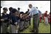 President George W. Bush greets players from the Meron's Academy Little League team in Panama City, Panama, Monday, Nov. 7, 2005. 