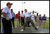 President George W. Bush delivers a pitch from the mound during a baseball event with Major League baseball players and Panamanian youth, Monday, Nov. 7, 2005 in Panama City, Panama. 