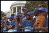 The Memphis Red Sox of the Satchel Paige Little League in Washington, D.C. watch as the President arrives May 6, 2001.