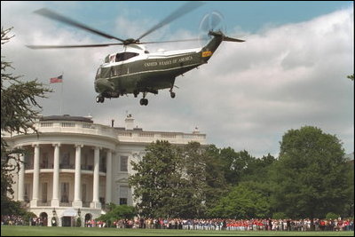 President George W. Bush arrives aboard Marine One from Camp David for the tee-ball game on the South Lawn event Sunday, May 7, 2001.