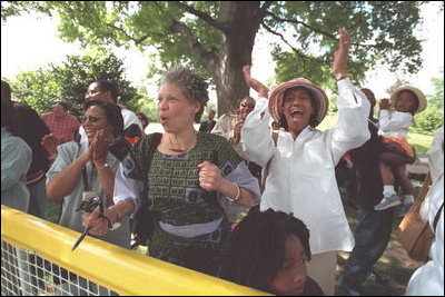 Family and friends of the Memphis Red Sox cheer their team during a tee-ball game on the South Lawn May 6, 2001.