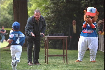 President Bush gave each player a memento of the afternoon during a tee-ball game on the South Lawn May 6, 2001.