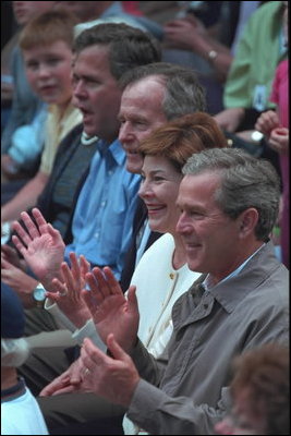 President Bush, Laura Bush, former President George Bush and the President's brother, Governor Jeb Bush, cheer on the players during the second Tee Ball game on the South Lawn on Sunday, June 3, 2001.