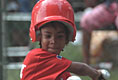 A player swings during the second Tee Ball game on the South Lawn on Sunday, June 3, 2001.