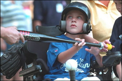 Decked out in T-shirts proclaiming themselves as either ""South Lawn Sluggers"" or ""South Lawn Buddies,"" about two dozen little leaguers played tee-ball on the White House South Lawn Sunday July 15, 2001.